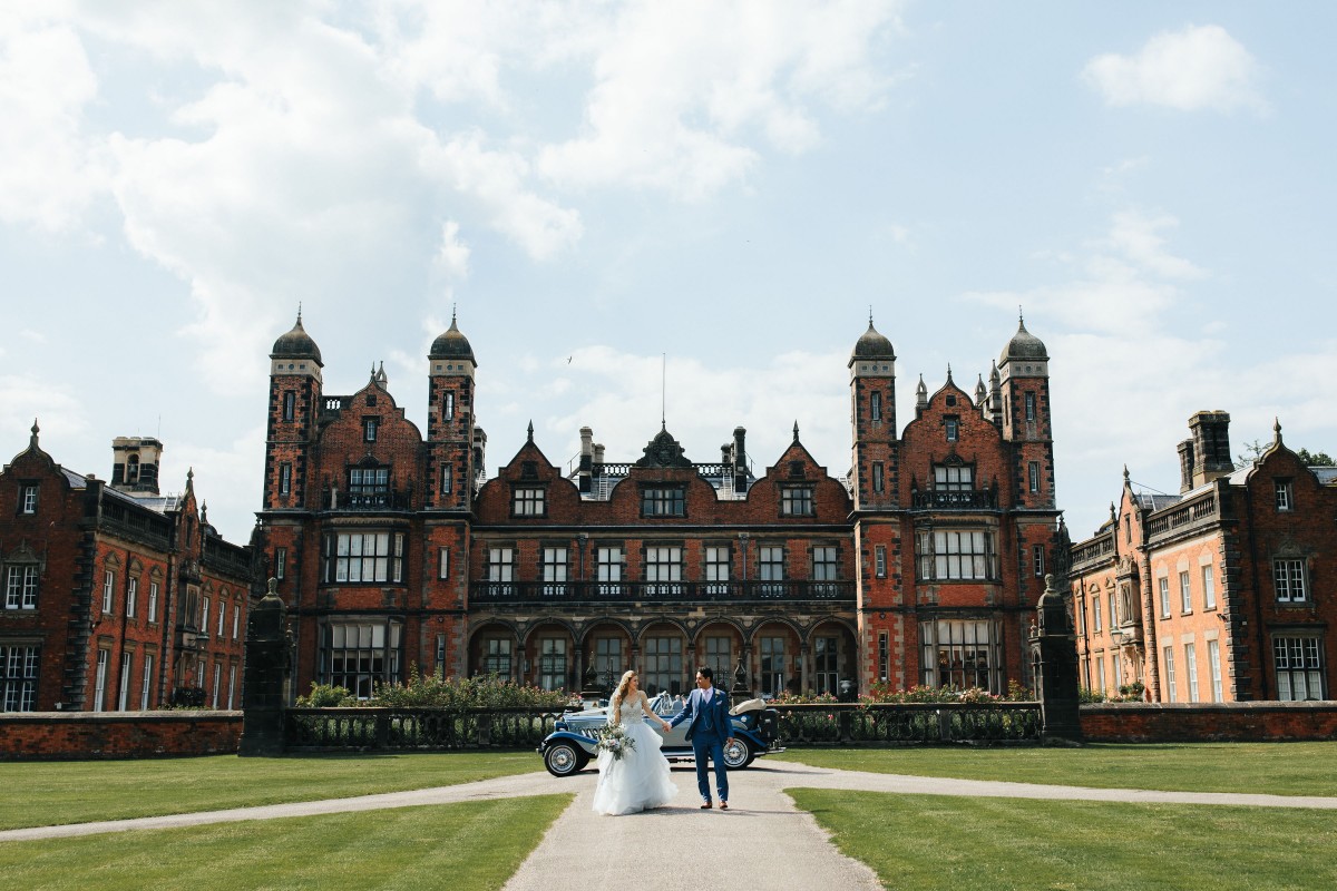 Newleyweds outside the grand Capesthorne Hall Wedding Venue