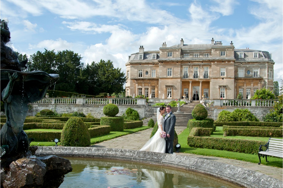 Newlyweds in the formal gardens of Luton Hoo Wedding Venue