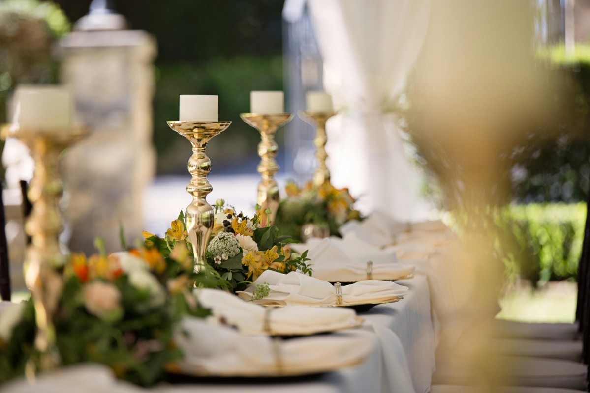 Wedding Table Display With Candles and Flowers Laid Out